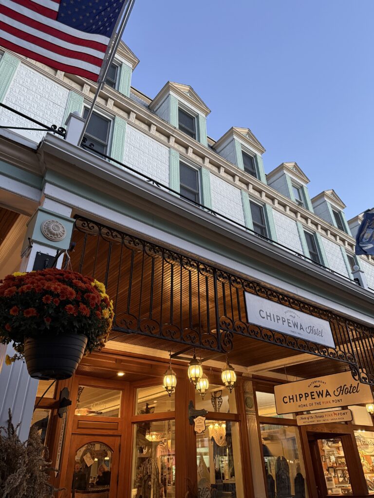Front of Chippewa Hotel Waterfront on Main Street in Mackinac Island with historic architecture and vibrant downtown setting