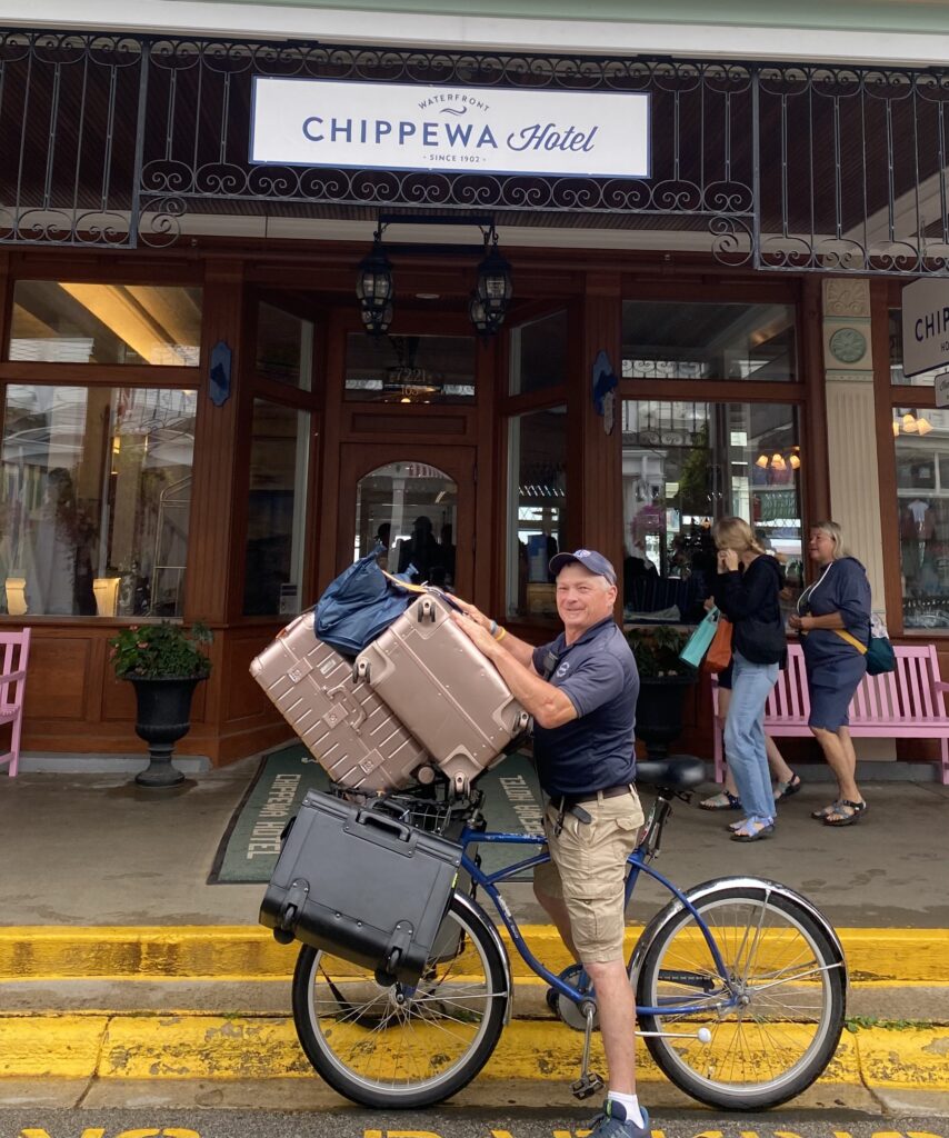 our dock porter with a lot of luggage coming from the ferry dock